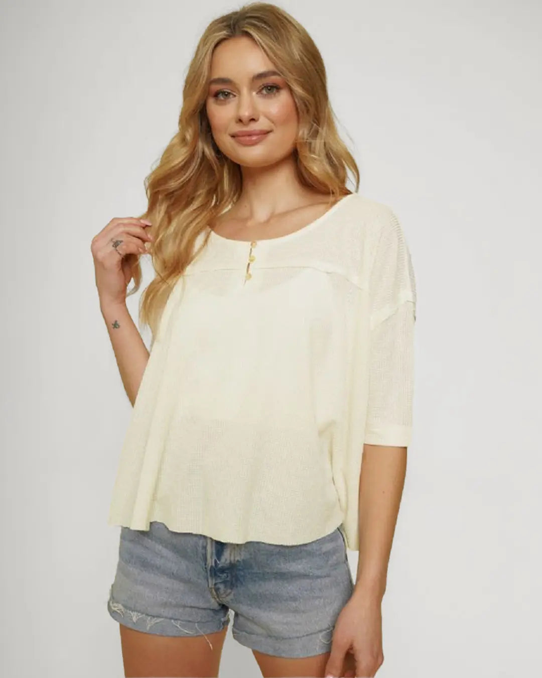 Elevate your casual style with our Drop Shoulder Oversized Henley, featuring a relaxed fit and trendy half-long sleeves. With a button closure boat neck and crafted from a cozy blend.