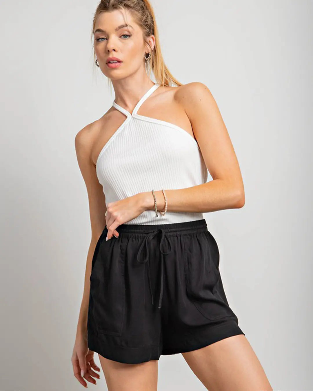 Elevate your summer style with our Curvy Drawstring Shorts, available in chic colors like Black or Mauve. Crafted from a comfortable blend of 85% rayon and 15% cotton, these shorts feature a classic drawstring design with front pockets, ensuring both style and functionality. Hand wash cold and hang to dry for easy care, and rest assured, they fit true to size for a flattering silhouette.