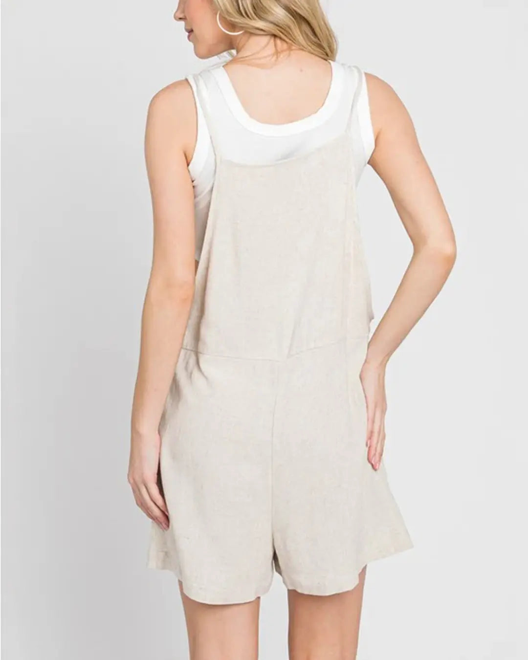 Gorgeous pull on jumper featuring adjustable spaghetti straps, front pockets, loose silhouette with dramatic wide legs in a soft light weight fabrication.