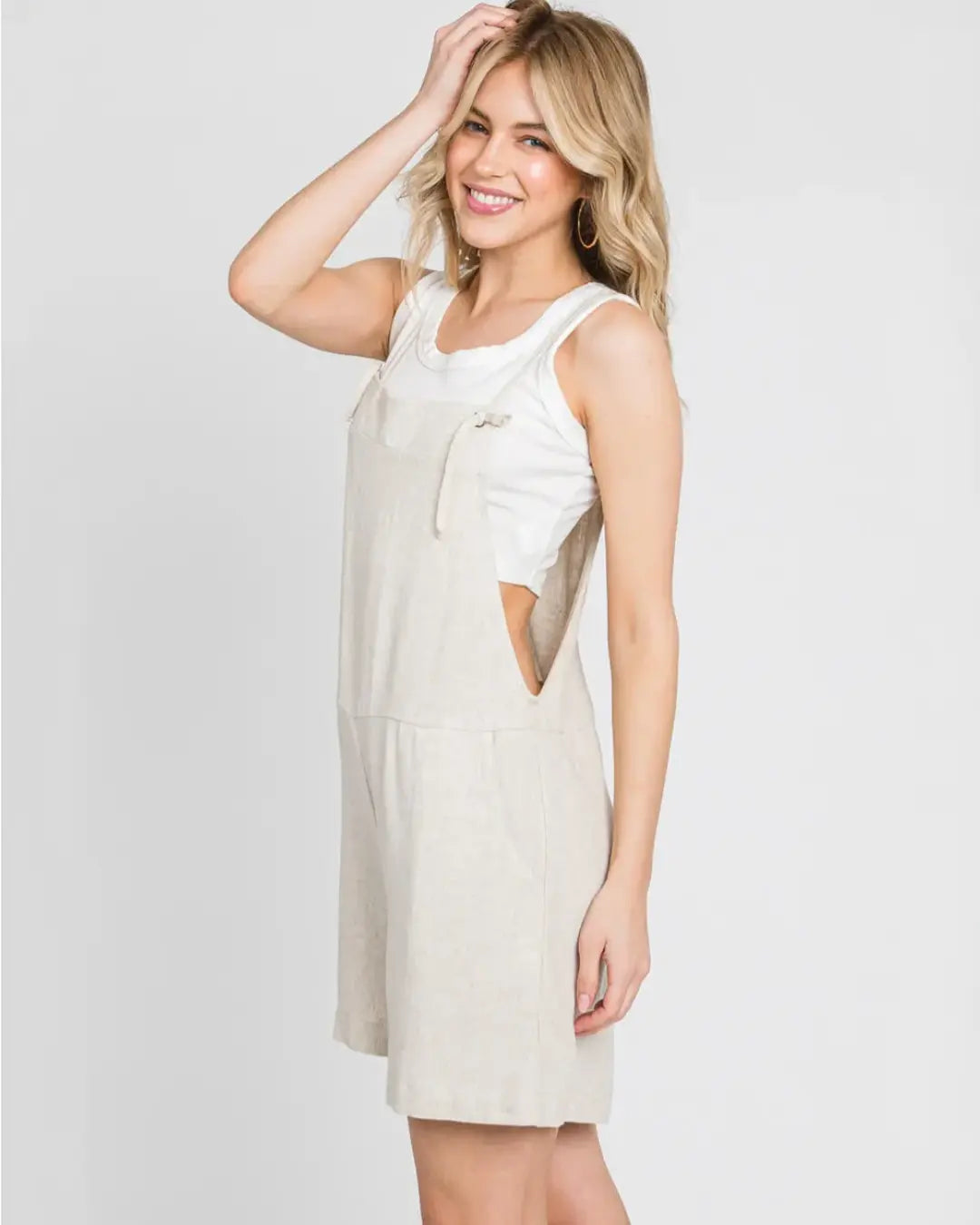Gorgeous pull on jumper featuring adjustable spaghetti straps, front pockets, loose silhouette with dramatic wide legs in a soft light weight fabrication.