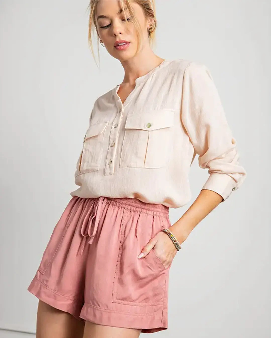 Elevate your summer style with our Curvy Drawstring Shorts, available in chic colors like Black or Mauve. Crafted from a comfortable blend of 85% rayon and 15% cotton, these shorts feature a classic drawstring design with front pockets, ensuring both style and functionality. Hand wash cold and hang to dry for easy care, and rest assured, they fit true to size for a flattering silhouette.