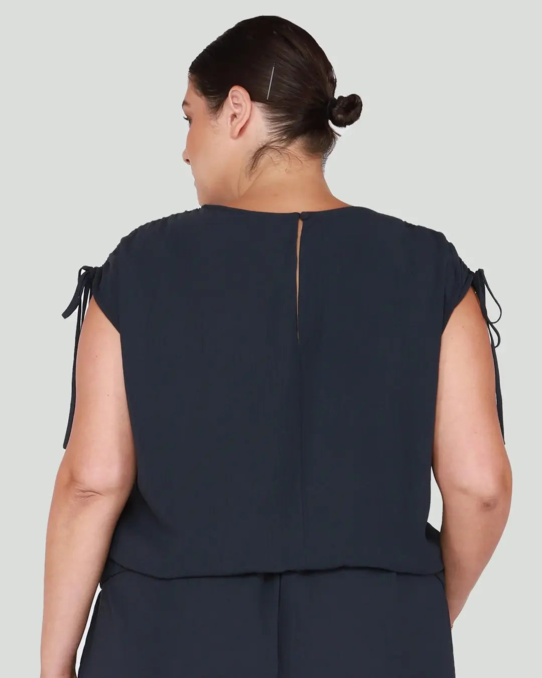 Elevate your casual chic look with our Drawstring Shoulder Midnight Navy Top, featuring stylish drawstring shoulders for added flair. Crafted with attention to detail and versatility in mind, this top is a must-have staple for any wardrobe.