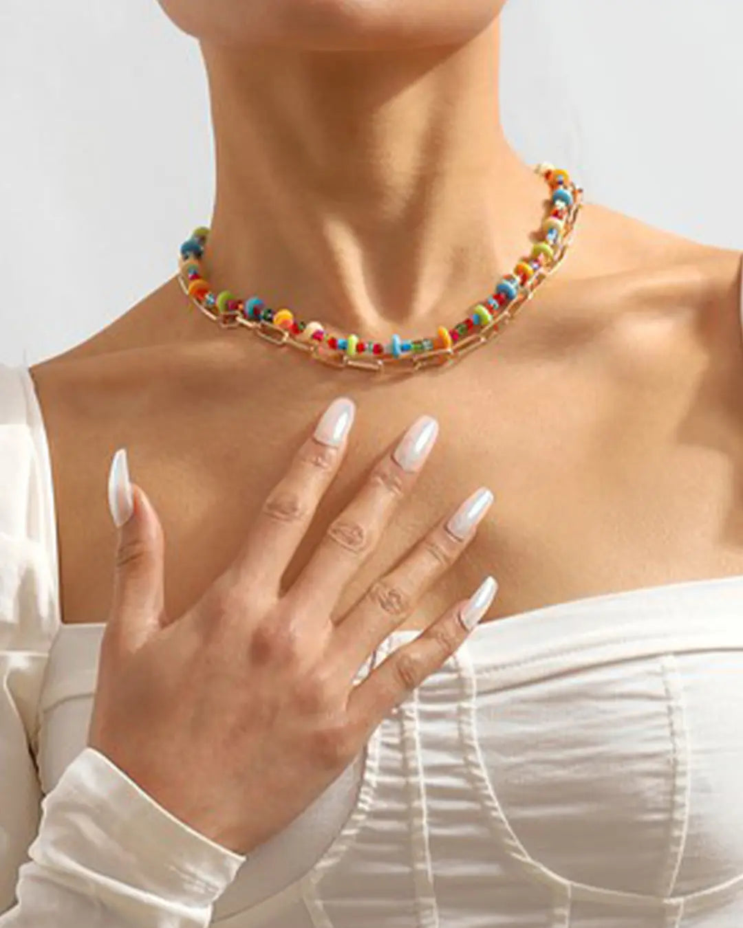 Elevate your style with our vibrant Rainbow Multi Chain Necklace, designed to add a pop of color and flair to any outfit. Featuring multiple chains in a spectrum of colors, this necklace is a versatile statement piece for every fashion-forward individual.