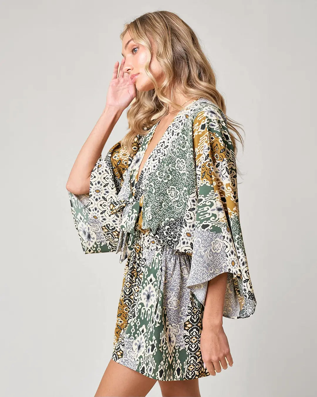 Channel your inner bohemian with our Boho Paisley Print Romper. With batwing sleeves and a tie front detail, this romper is both stylish and comfortable. Complete with side pockets and made from breathable fabrics, you'll feel super flattering and ready to rock those western vibes.