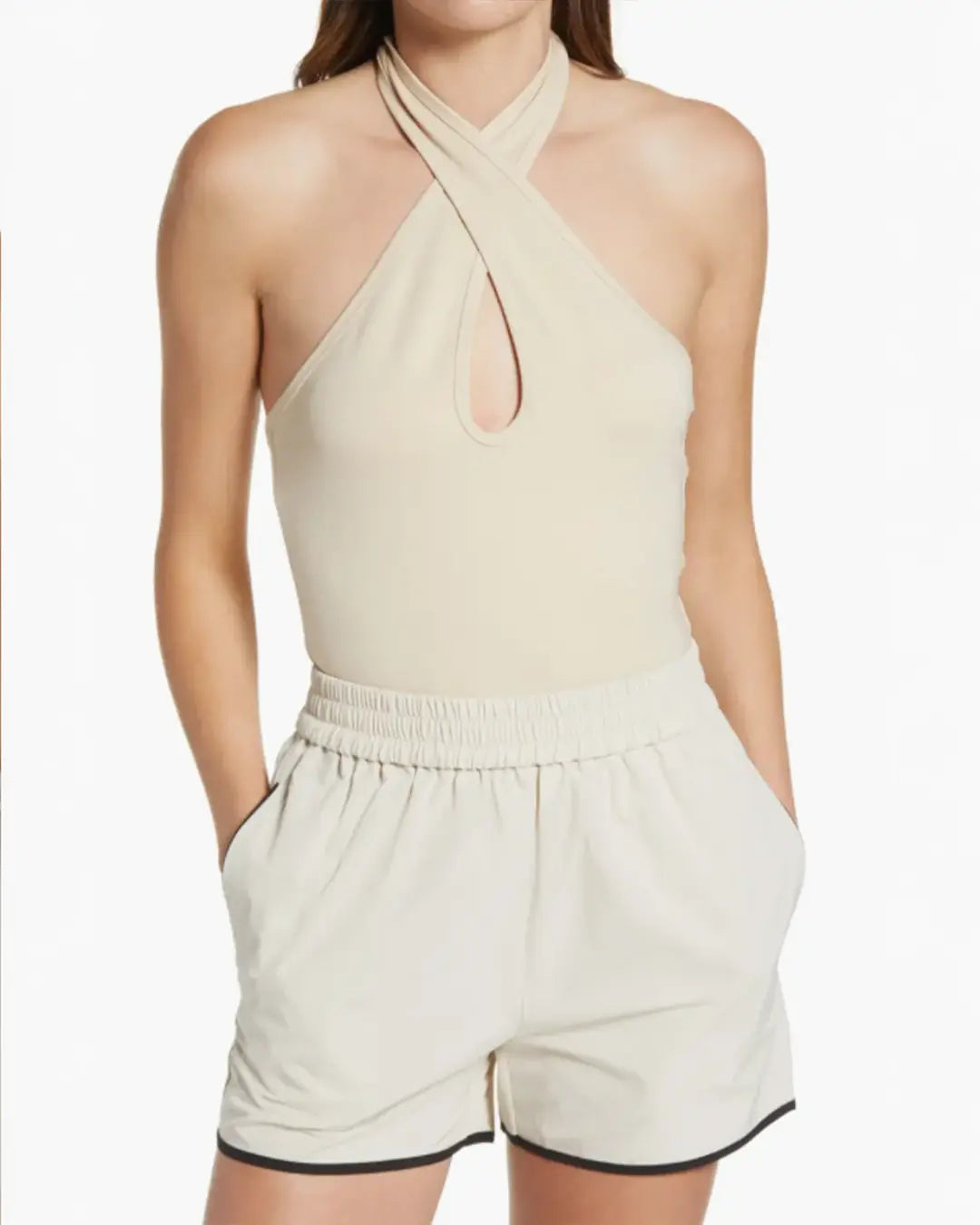 Keep it sleek and summery in a knit top to show off your shoulders with an added plot twist to the style story.