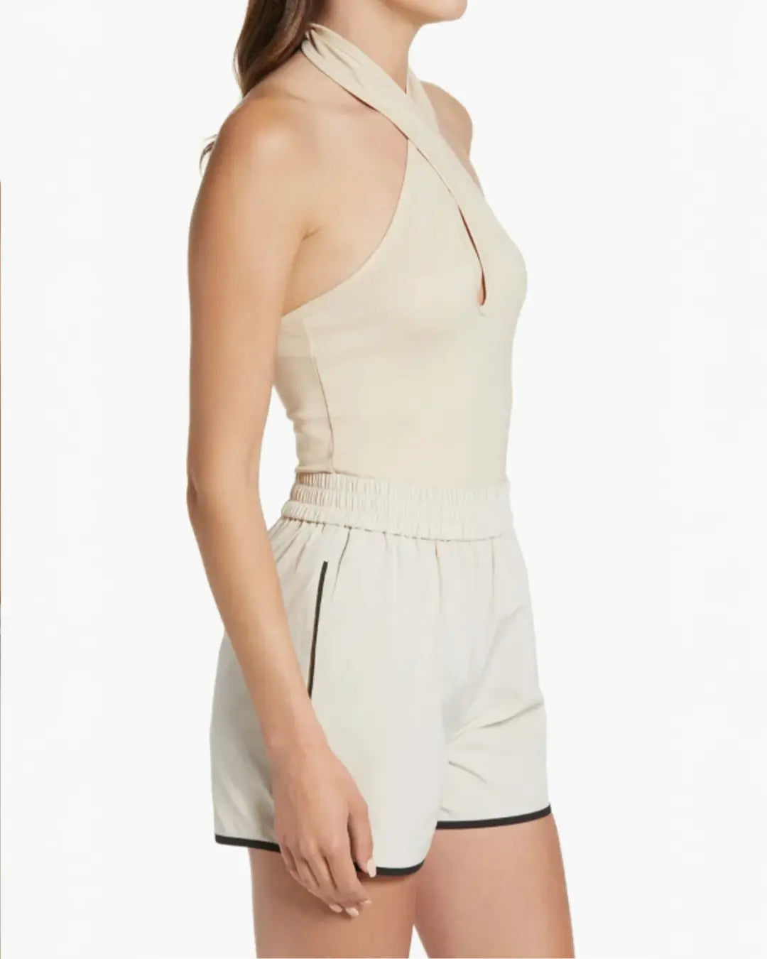 Keep it sleek and summery in a knit top to show off your shoulders with an added plot twist to the style story.