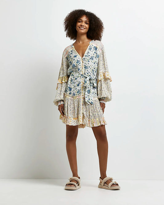 Elevate your summer wardrobe with our charming Blue Mixed Florals Mini Dress, complete with delicate ruffle sleeves for a feminine touch. Crafted from 100% viscose, it offers both style and comfort, making it the perfect choice for sunny days and warm evenings.