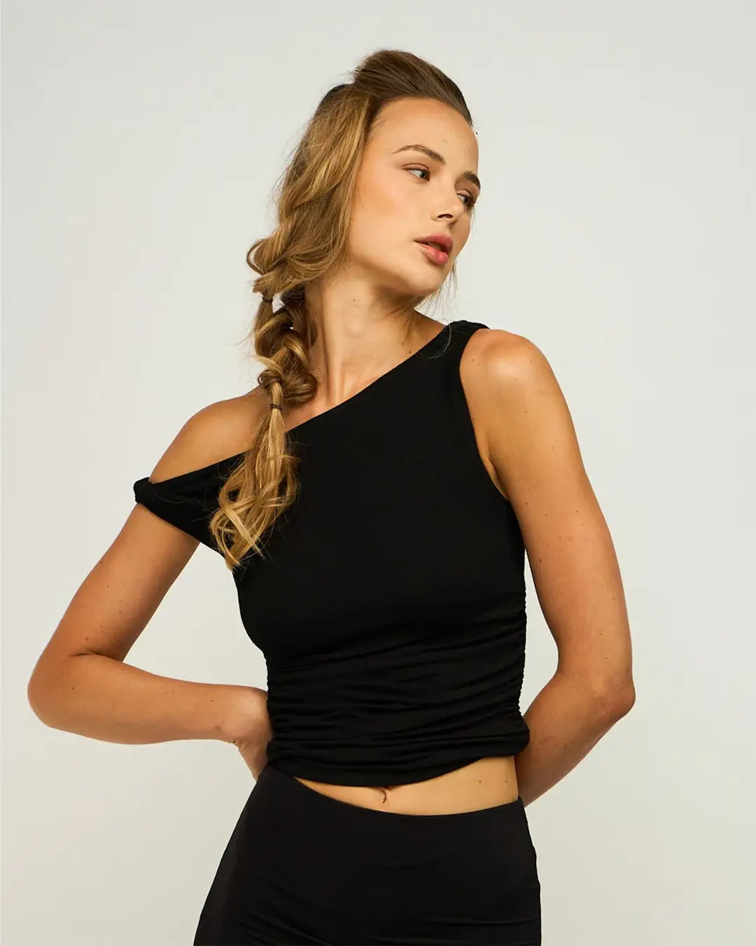 Be bold and trendy in our Hear Me Out Asymmetric Top. This one shoulder top is a must-have for spring outings. Its asymmetrical hem adds a touch of elegance to your wardrobe, making it the perfect elevated basic.