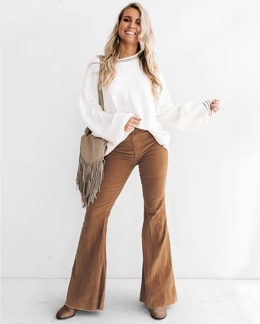Experience the warmth and style of Corduroy Flare Pants; featuring pockets, elastic waist, and crafted with a luxurious blend of Cotton 97% and Spandex 3%. Have confidence knowing these pants won't stretch, shrink, or fade even after washing. Step out with a look that's comfortable, chic, and sure to turn heads.