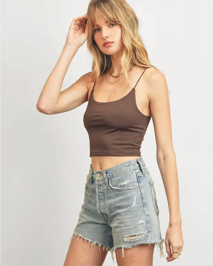 Elevate your summer style with our supportive Double Layered Crop Top, featuring double scoop necklines and elastic cord straps for a comfortable fit. Crafted from a blend of 97% polyester and 3% spandex, it offers both style and stretch for all-day wear.