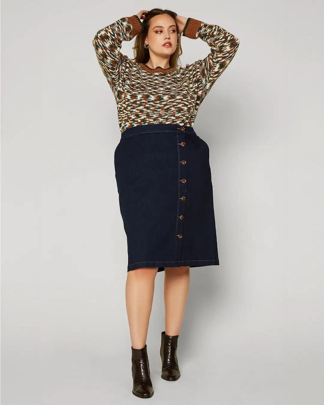 A dark denim skirt is a classic piece that you can wear season after season. This version is especially lustworthy in a curve-enhancing silhouette with a trail of buttons down the front. Wear it with your favorite tee or tank when it’s warm out, then add a cozy sweater when the temperature drops.