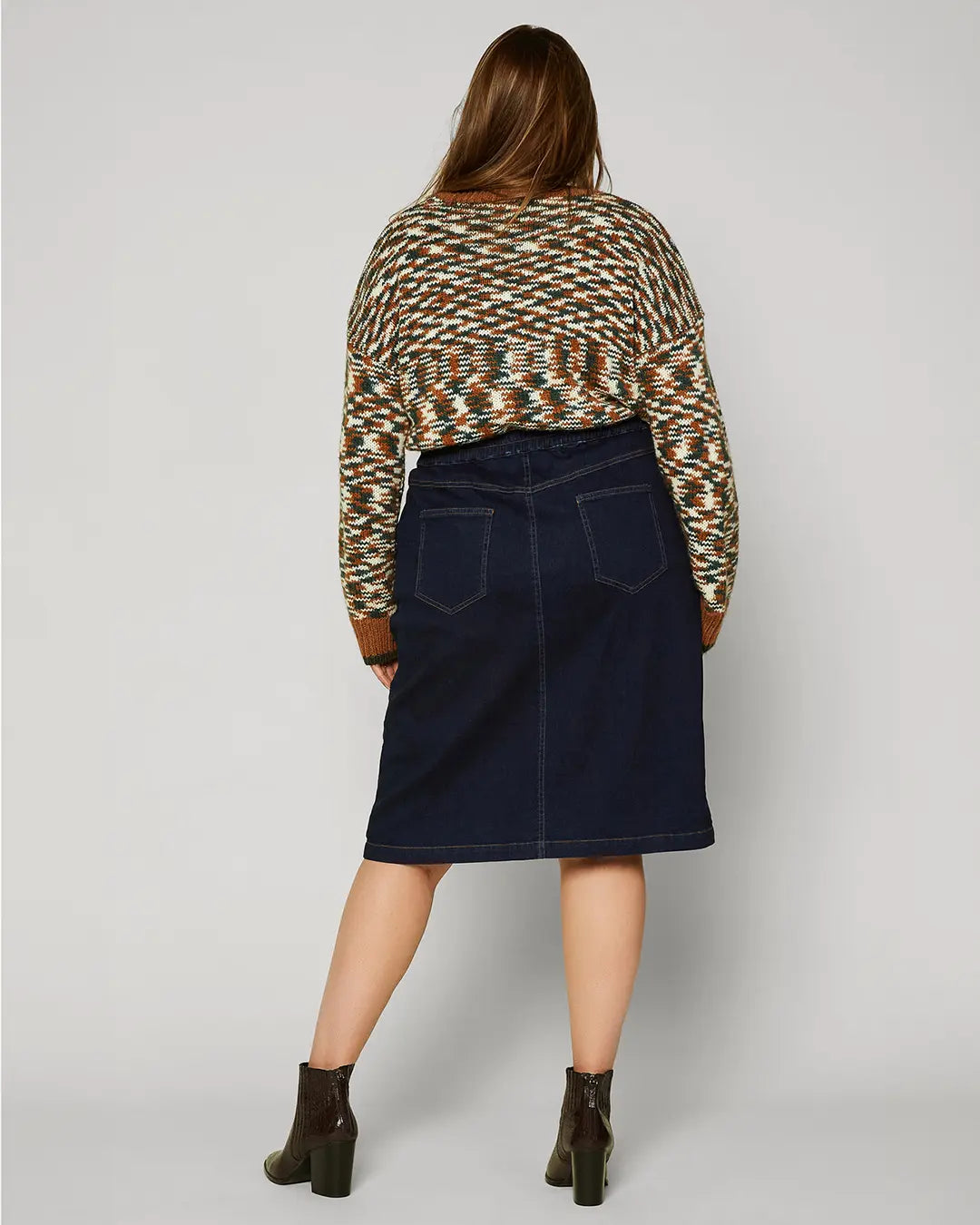 A dark denim skirt is a classic piece that you can wear season after season. This version is especially lustworthy in a curve-enhancing silhouette with a trail of buttons down the front. Wear it with your favorite tee or tank when it’s warm out, then add a cozy sweater when the temperature drops.