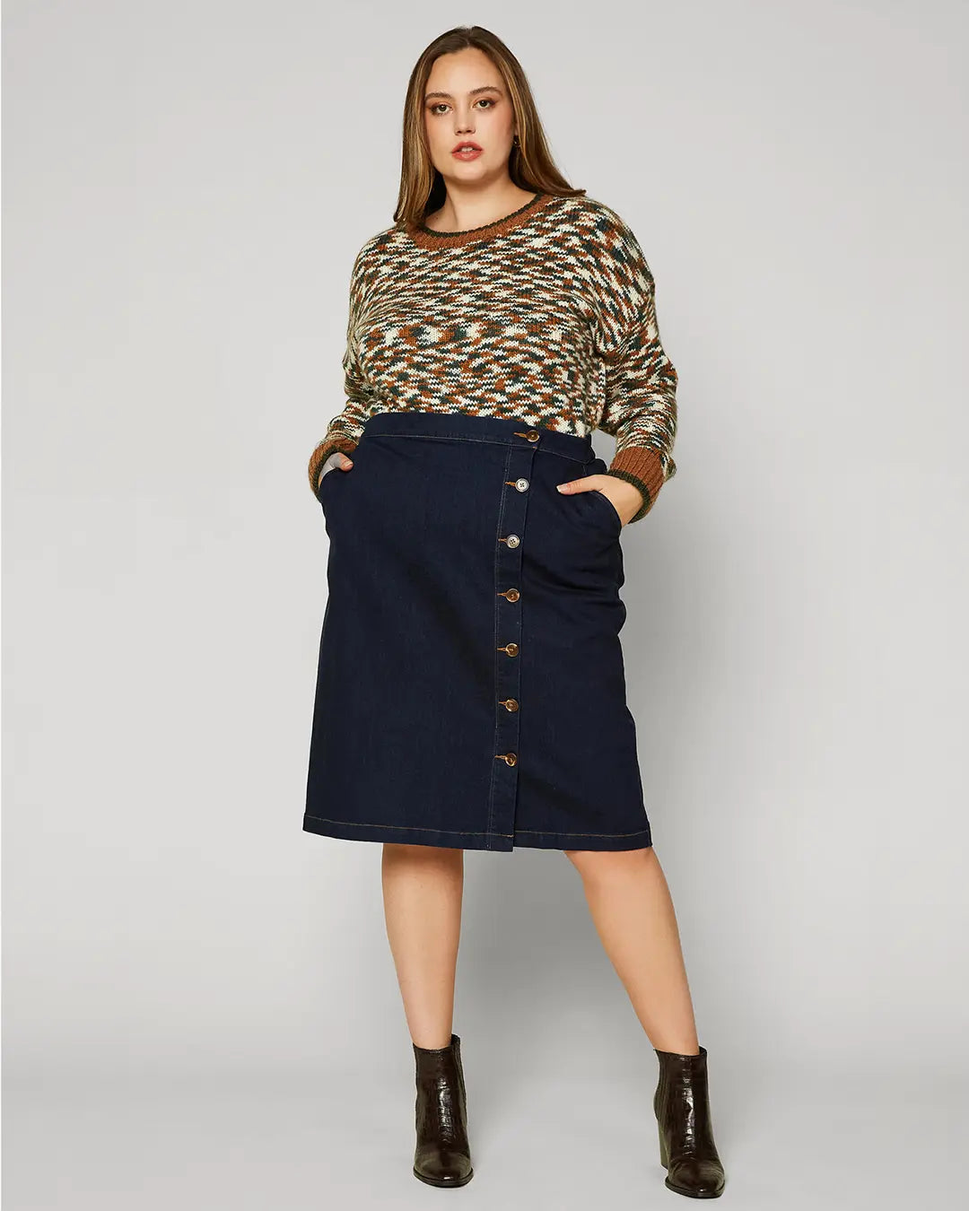 A dark denim skirt is a classic piece that you can wear season after season. This version is especially lustworthy in a curve-enhancing silhouette with a trail of buttons down the front. Wear it with your favorite tee or tank when it’s warm out, then add a cozy sweater when the temperature drops.