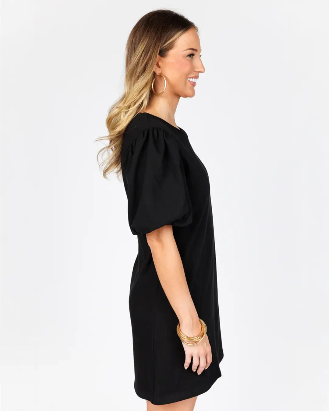 Elevate your wardrobe with our Ribbed Round Neck Knit Dress, boasting short balloon sleeves, convenient front slanted pockets, and a chic mini length. Crafted from high-quality 100% polyester, this dress offers both style and comfort for any occasion.